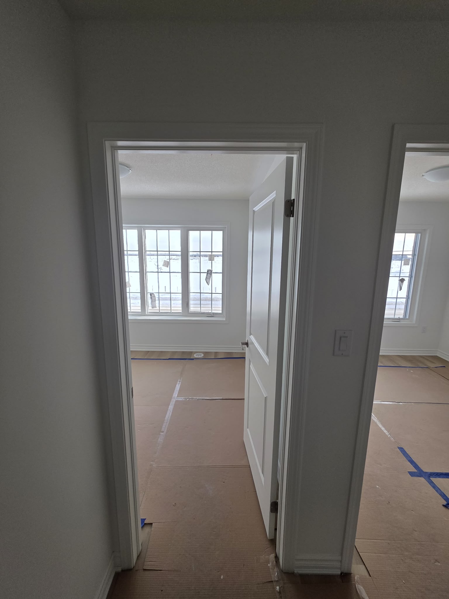 Finished white casing around an interior room opening